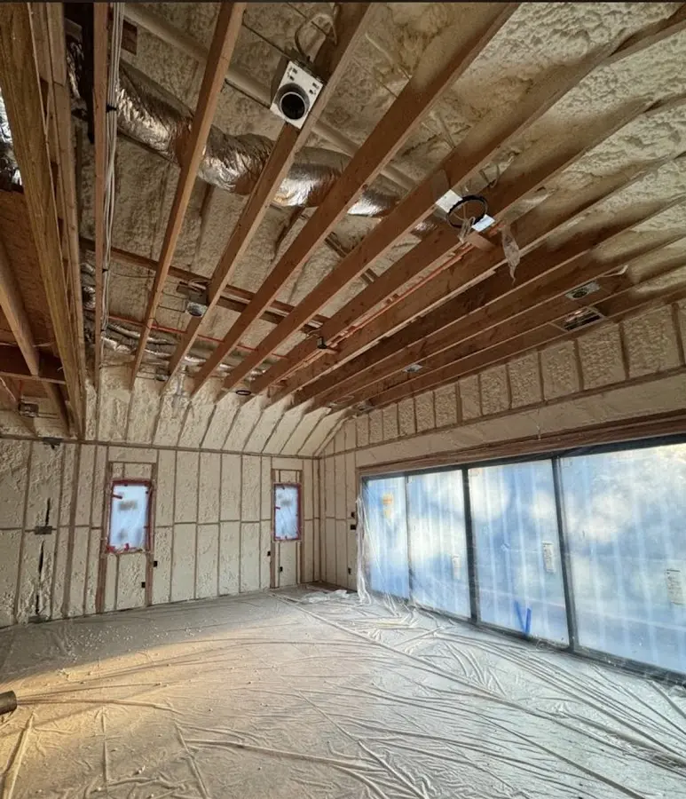 Interior walls and ceiling insulated with spray foam during new construction in New Holland